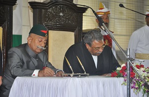 The Governor designate Brig. (Dr.) B.D. Mishra (Retd) signing oath paper in presence of Hon�ble Chief justice of Gauhati High Court Mr. Ajit Singh in the Darbar Hall of Raj Bhavan , Itanagar on 3rd October�2017.